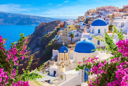 a church on a mountain cliff in Greece